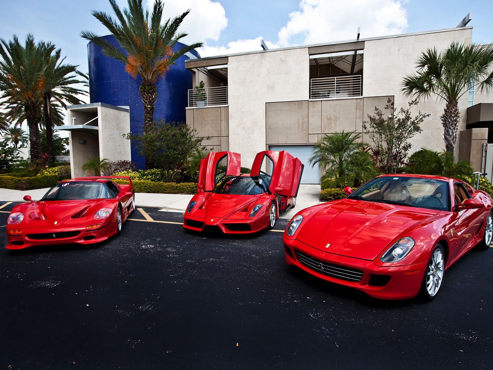 Download wallpaper 1600x1200 building, ferrari, red, palms standard 4:3