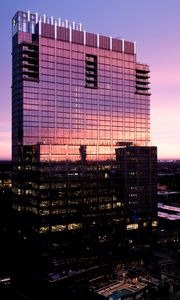 Preview wallpaper building, glass, windows, reflection, sunset