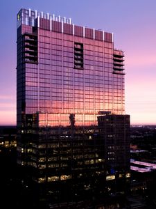 Preview wallpaper building, glass, windows, reflection, sunset