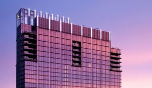 Preview wallpaper building, glass, windows, reflection, sunset