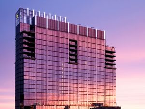 Preview wallpaper building, glass, windows, reflection, sunset