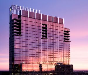 Preview wallpaper building, glass, windows, reflection, sunset
