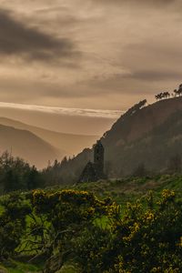 Preview wallpaper building, hills, fog, nature