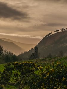 Preview wallpaper building, hills, fog, nature