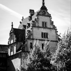 Preview wallpaper building, house, sculpture, black and white, trees