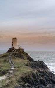 Preview wallpaper building, lighthouse, rock, stairs, sea