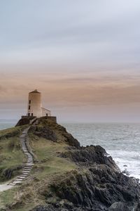 Preview wallpaper building, lighthouse, rock, stairs, sea