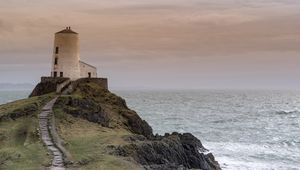 Preview wallpaper building, lighthouse, rock, stairs, sea