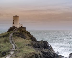 Preview wallpaper building, lighthouse, rock, stairs, sea