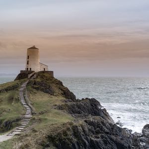 Preview wallpaper building, lighthouse, rock, stairs, sea