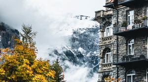 Preview wallpaper building, mountain, trees, clouds, nature