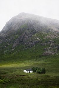 Preview wallpaper building, mountain, valley, nature, greenery