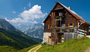 Preview wallpaper building, nature, mountains, sky