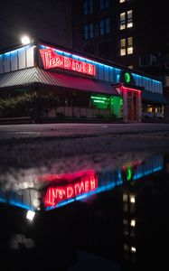 Preview wallpaper building, neon, sign, puddle, reflection