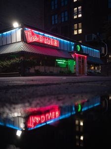Preview wallpaper building, neon, sign, puddle, reflection