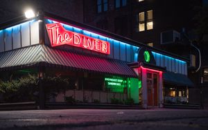 Preview wallpaper building, neon, sign, puddle, reflection