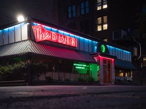 Preview wallpaper building, neon, sign, puddle, reflection