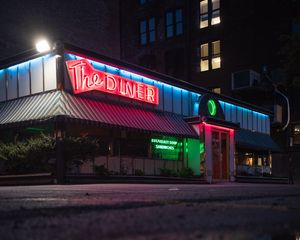 Preview wallpaper building, neon, sign, puddle, reflection