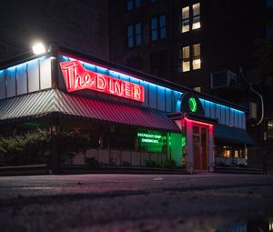 Preview wallpaper building, neon, sign, puddle, reflection