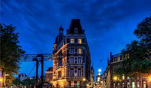 Preview wallpaper building, night city, bridge, reflection, lights