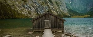 Preview wallpaper building, pier, rocks, mountains, lake