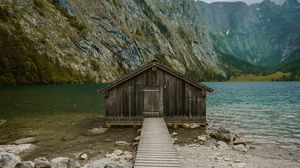 Preview wallpaper building, pier, rocks, mountains, lake