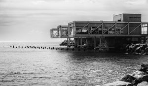 Preview wallpaper building, pilings, architecture, sea, black and white