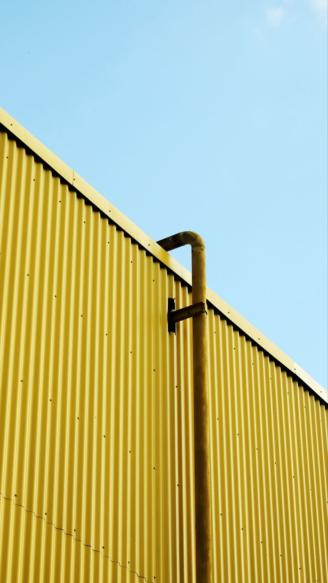 1080x1920 Wallpaper building, pipe, yellow, minimalism