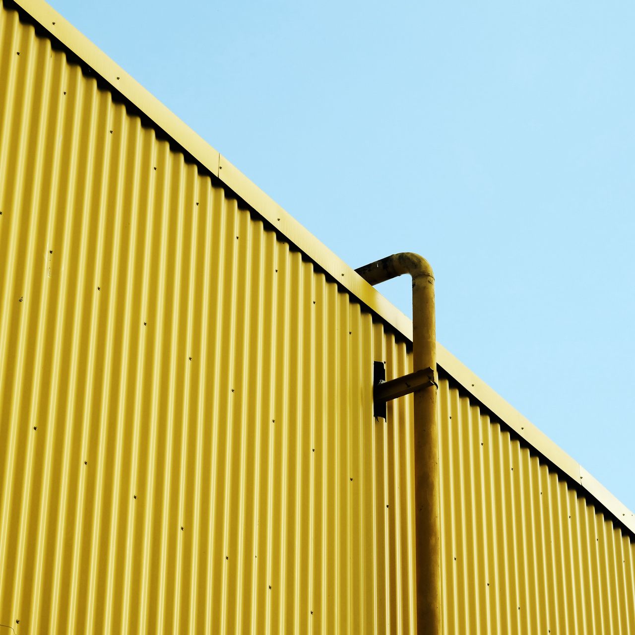 1280x1280 Wallpaper building, pipe, yellow, minimalism