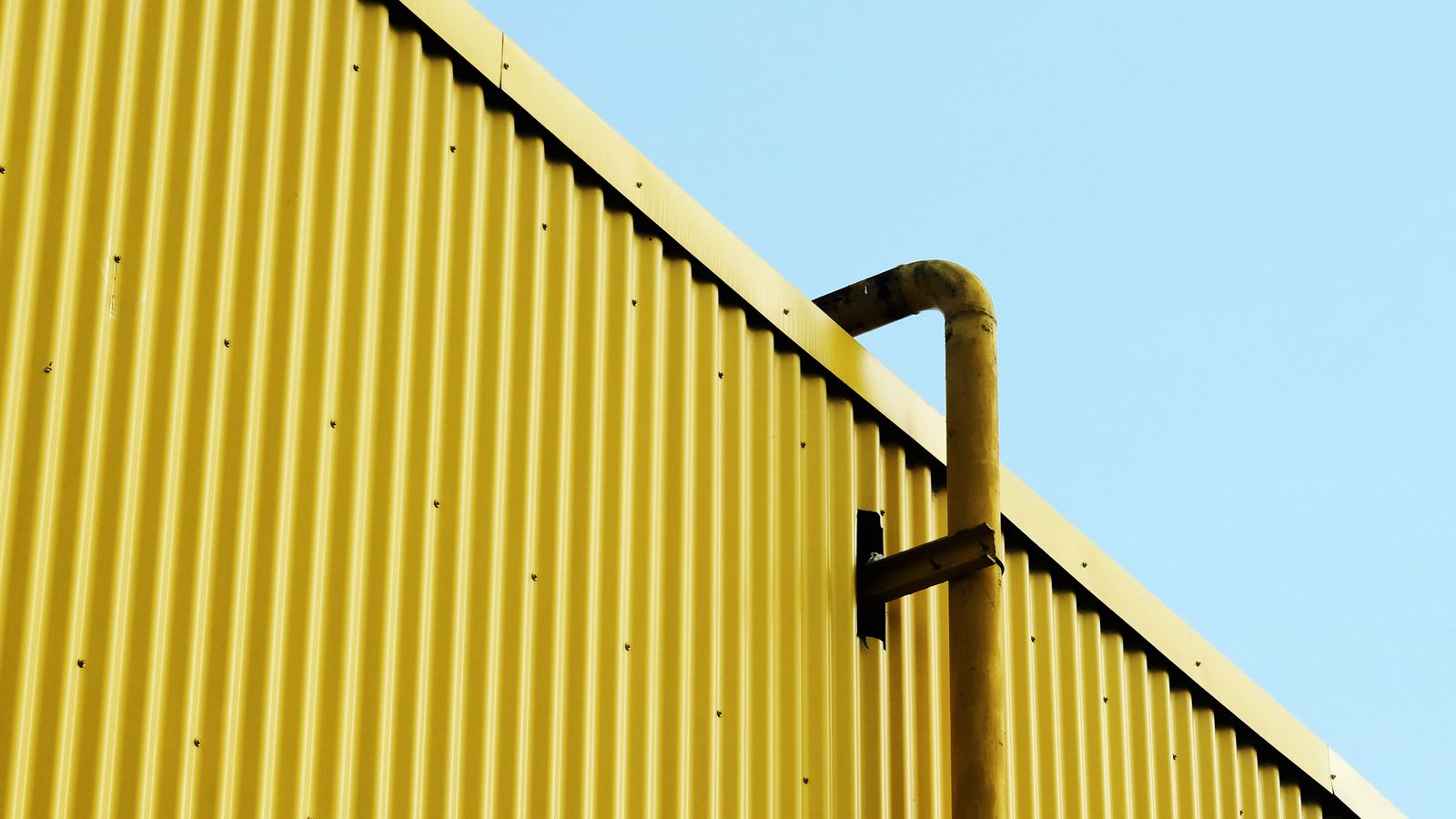 1600x900 Wallpaper building, pipe, yellow, minimalism