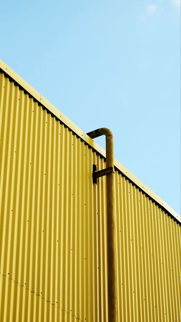 360x640 Wallpaper building, pipe, yellow, minimalism