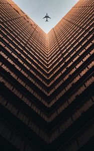 Preview wallpaper building, plane, sky, symmetry, architecture