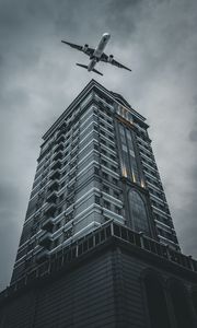 Preview wallpaper building, plane, sky, gray