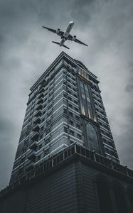 Preview wallpaper building, plane, sky, gray