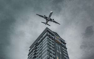 Preview wallpaper building, plane, sky, gray
