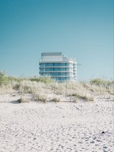 Preview wallpaper building, sand, dunes, grass, minimalism