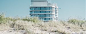 Preview wallpaper building, sand, dunes, grass, minimalism