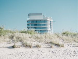 Preview wallpaper building, sand, dunes, grass, minimalism