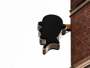 Preview wallpaper building, sign, head, wall