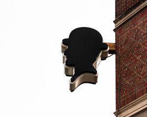 Preview wallpaper building, sign, head, wall