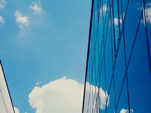 Preview wallpaper building, sky, clouds, glass, blue