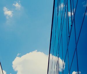 Preview wallpaper building, sky, clouds, glass, blue