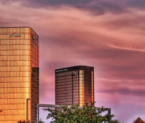 Preview wallpaper building, sky, sunset, skyscrapers