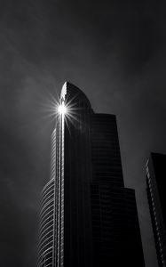 Preview wallpaper building, skyscraper, glare, rays, bw