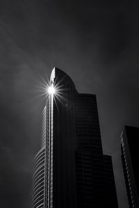 Preview wallpaper building, skyscraper, glare, rays, bw