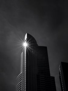 Preview wallpaper building, skyscraper, glare, rays, bw