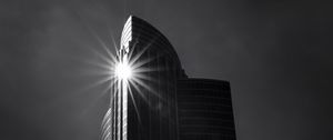 Preview wallpaper building, skyscraper, glare, rays, bw