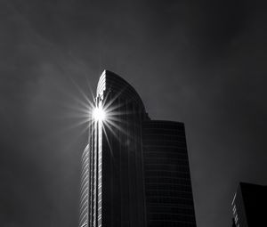 Preview wallpaper building, skyscraper, glare, rays, bw