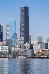 Preview wallpaper building, skyscrapers, river, ship, embankment