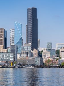 Preview wallpaper building, skyscrapers, river, ship, embankment